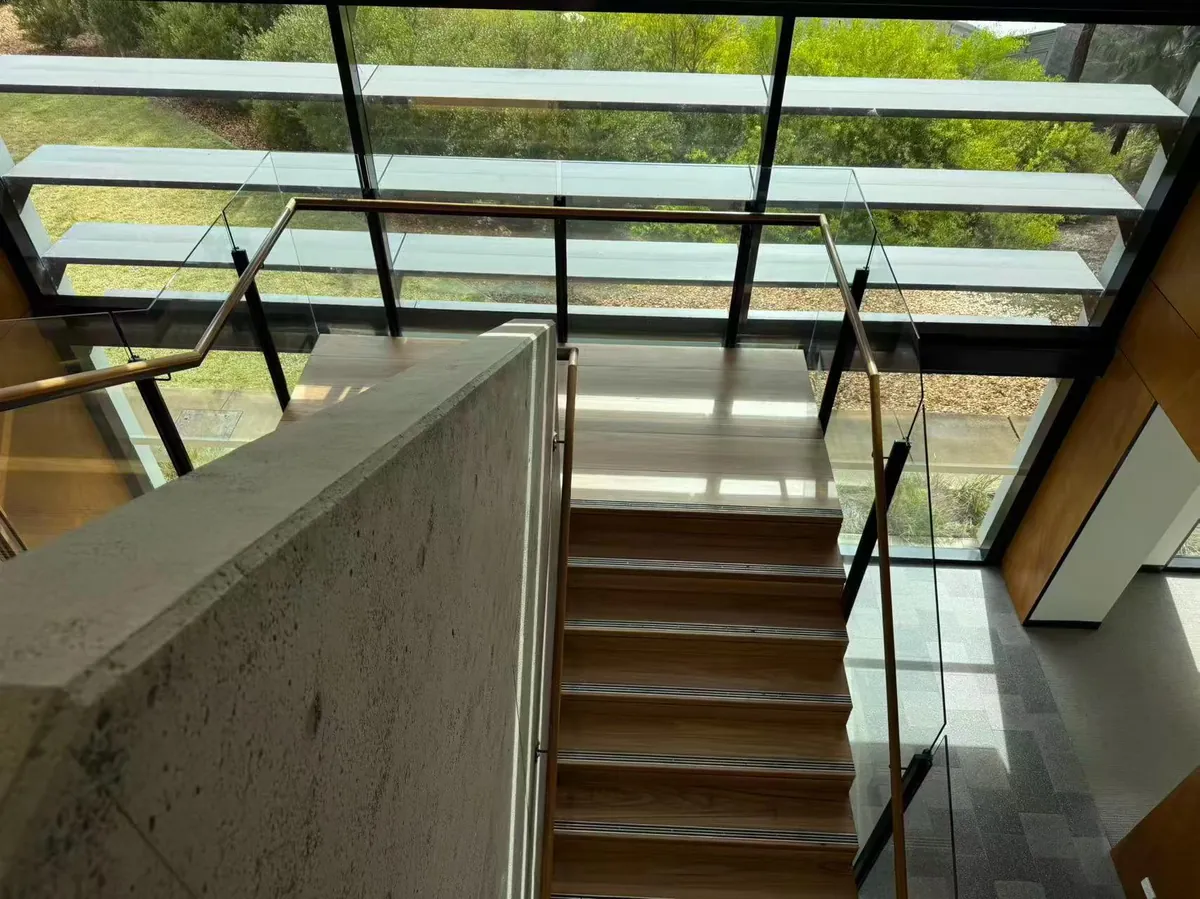 Wide view of the timber staircase and glass balustrade at Tallawong Metro